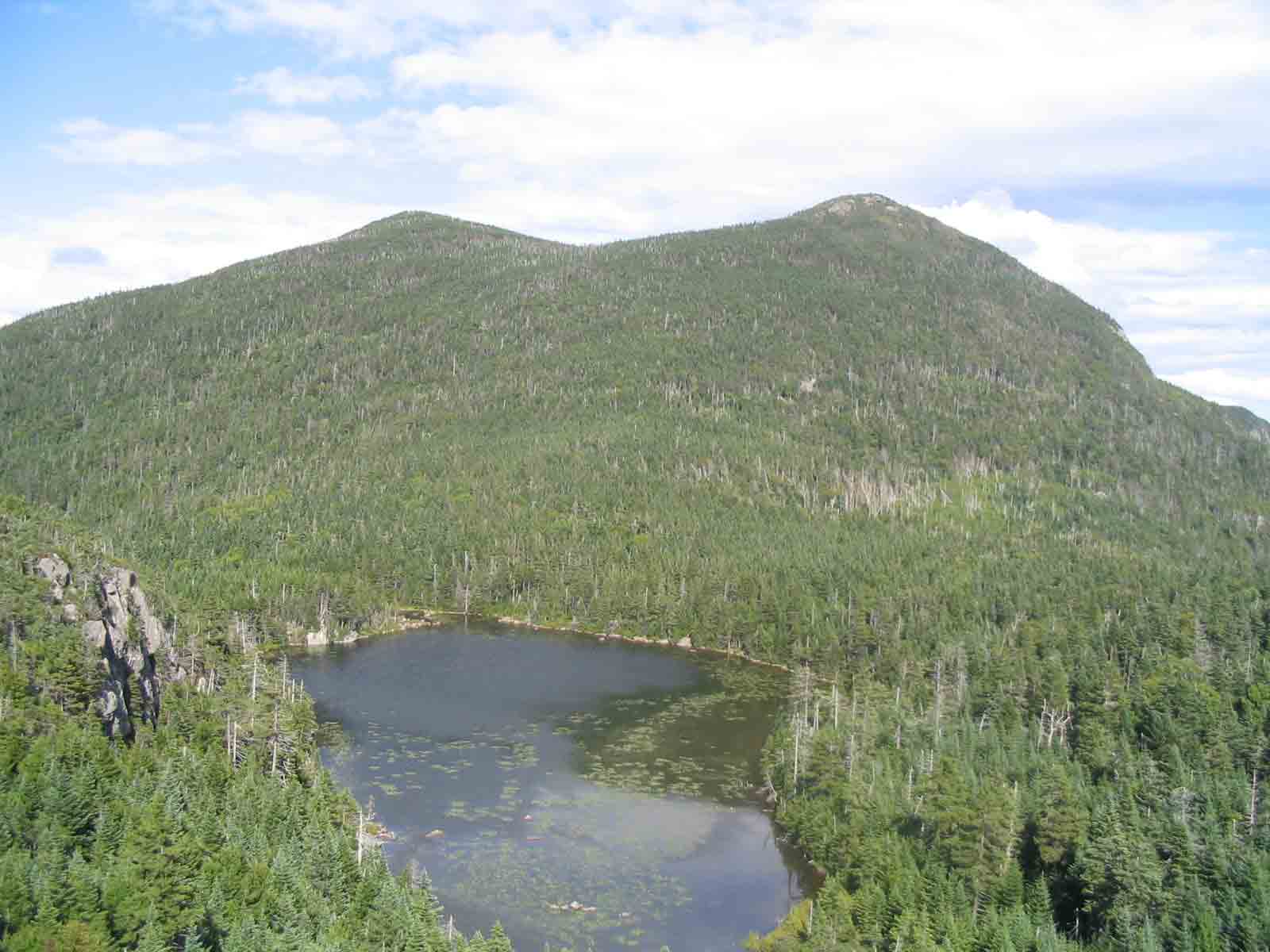 31.9 MM. What an awesome view of tranquil Horns Pond below you and the two Horns (North and South) beyond. This 50 yard short spur for this view is well worth the side trip. Many backpackers and moose love to stay at the scenic Horns Pond campsite located by the lake. Courtesy askus3@optonline.net